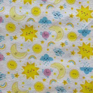 Flannel Fabric With Brightly Colored Suns, Moons, Clouds and Rainbows